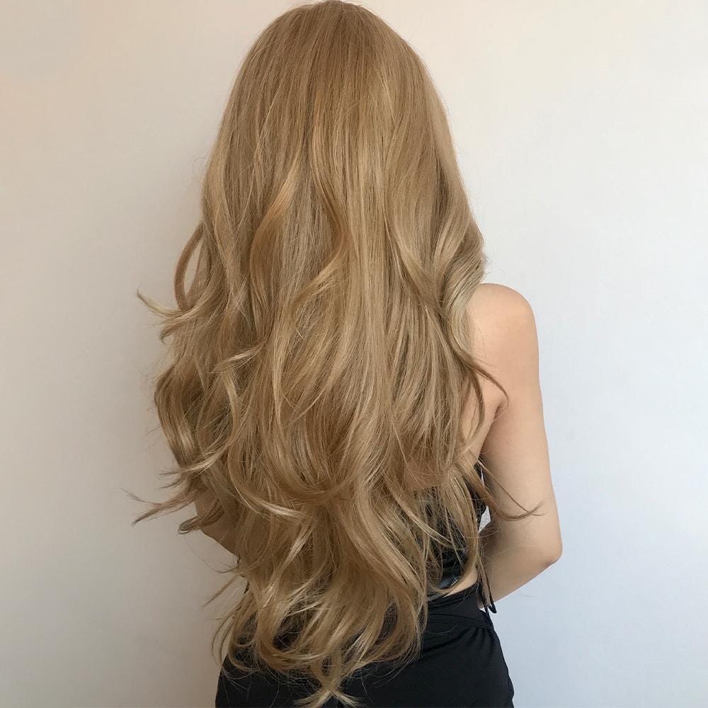 HAIRCUBE honey blonde lace front wig with long wavy hair styled from the back