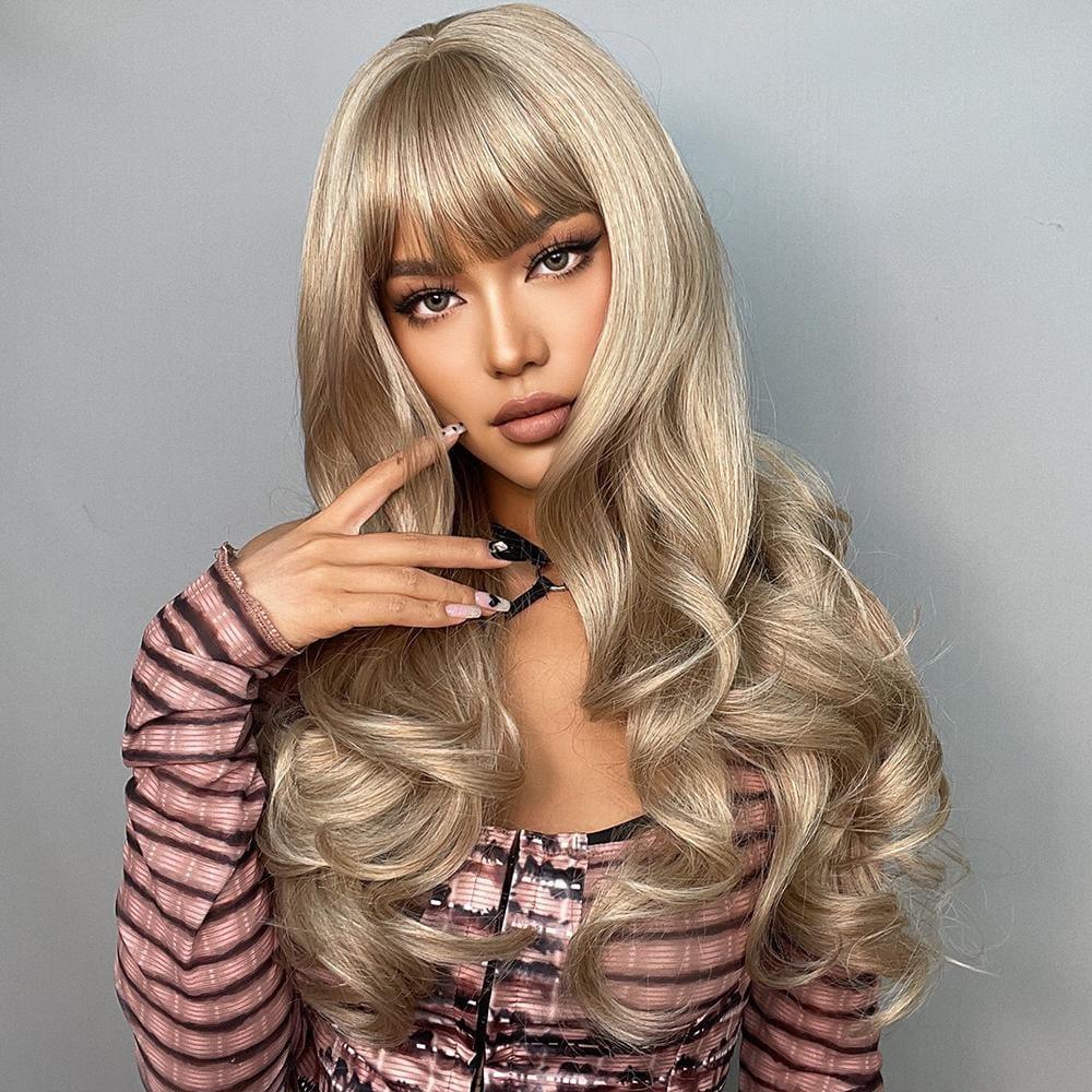 Alan long blonde curly wig styled with soft waves and bangs on a female model