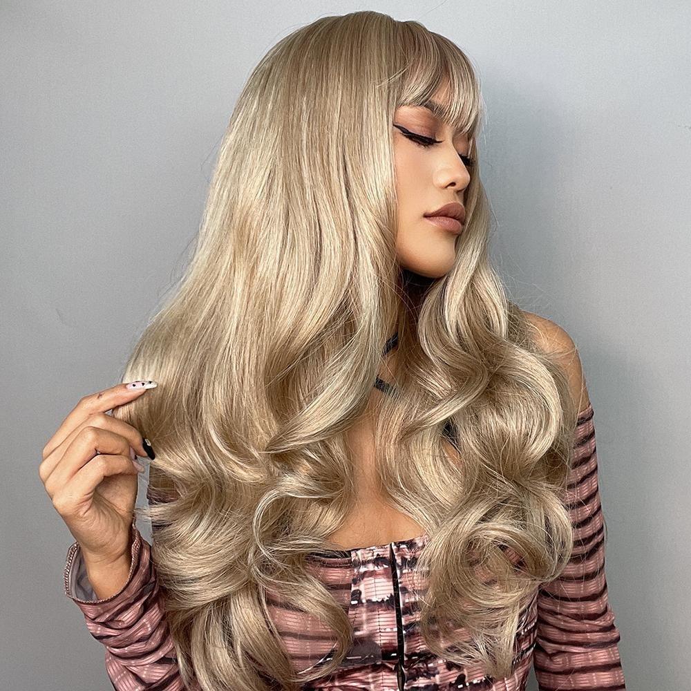 Woman wearing Alan long blonde curly wig with voluminous soft waves and bangs
