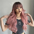 oneNonly long wavy pink wig worn by model with bangs and layered curls