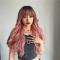 oneNonly long wavy pink wig with soft waves and natural look on model with bangs