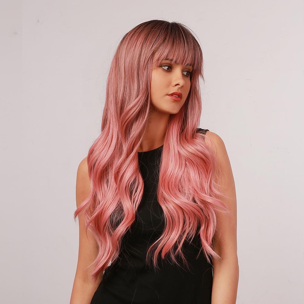 oneNonly long wavy pink wig with full bangs styled on a model wearing a black top
