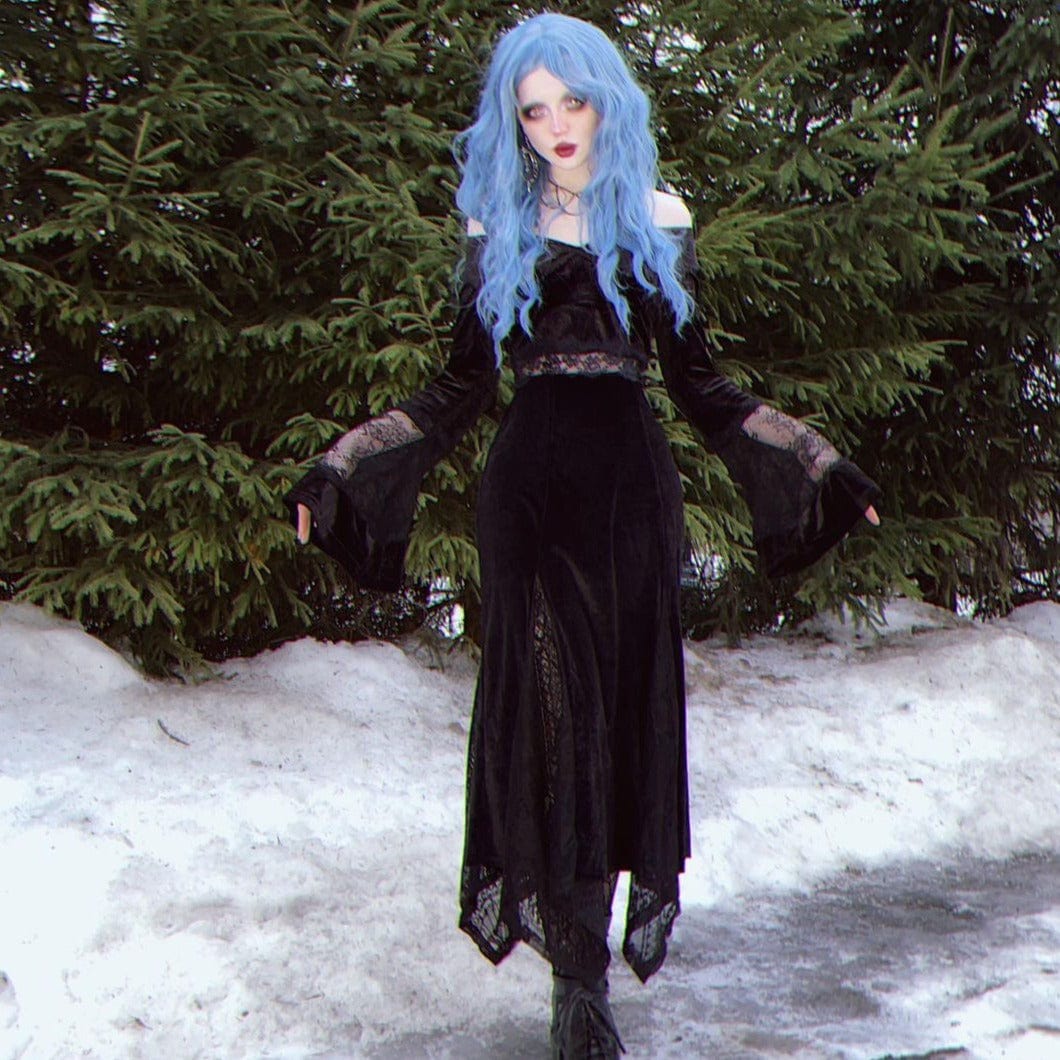 HAIRCUBE mermaid blue synthetic wig styled with long wavy hair on model wearing black dress outdoors