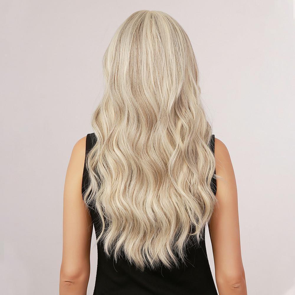 La Sylphide 22 inch loose wave synthetic wig in platinum blonde with bangs on woman