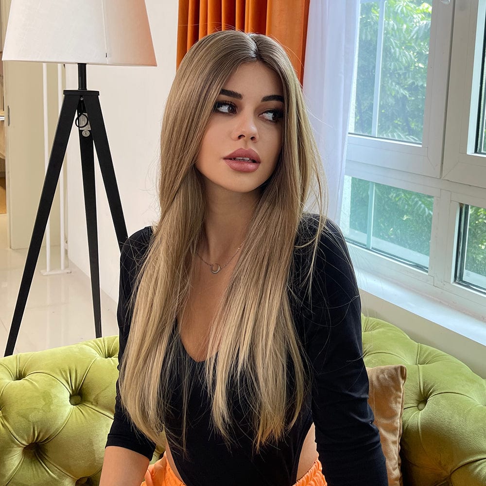HAIRCUBE 21 inch straight lace front wig styled on model with long sleek blonde hair indoors