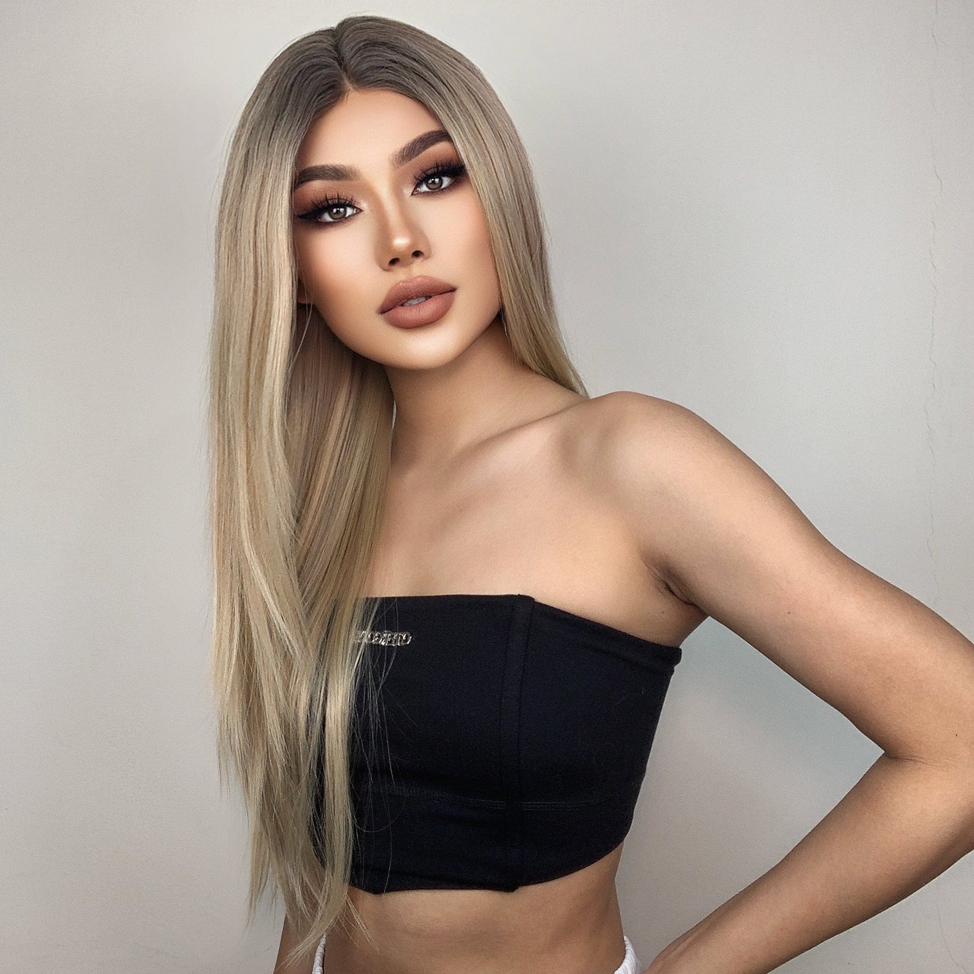 HAIRCUBE 21 inch straight lace front wig worn by model with long blonde hair and black tube top